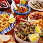 Traditional Spain cuisine food infographic featuring paella, tapas, jamón ibérico, seafood dishes, regional Spanish cuisine, and Mediterranean food culture.
