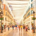 Infographic showing Malaga weather in November 2026 with temperatures, rainfall, sunshine hours, beach conditions, travel tips, and best things to do in Malaga, Spain during autumn.