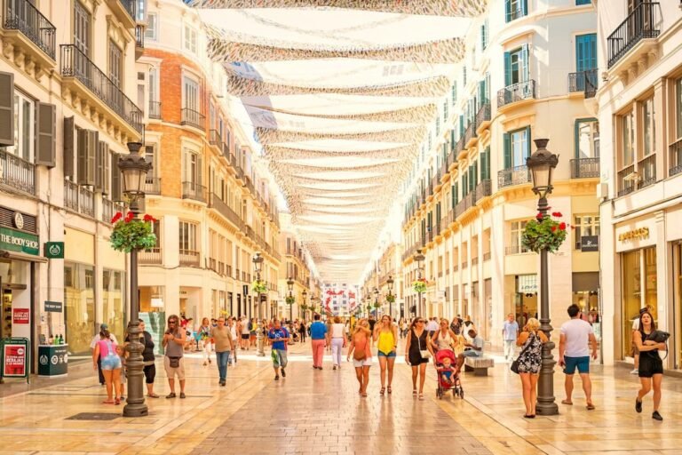 Infographic showing Malaga weather in November 2026 with temperatures, rainfall, sunshine hours, beach conditions, travel tips, and best things to do in Malaga, Spain during autumn.
